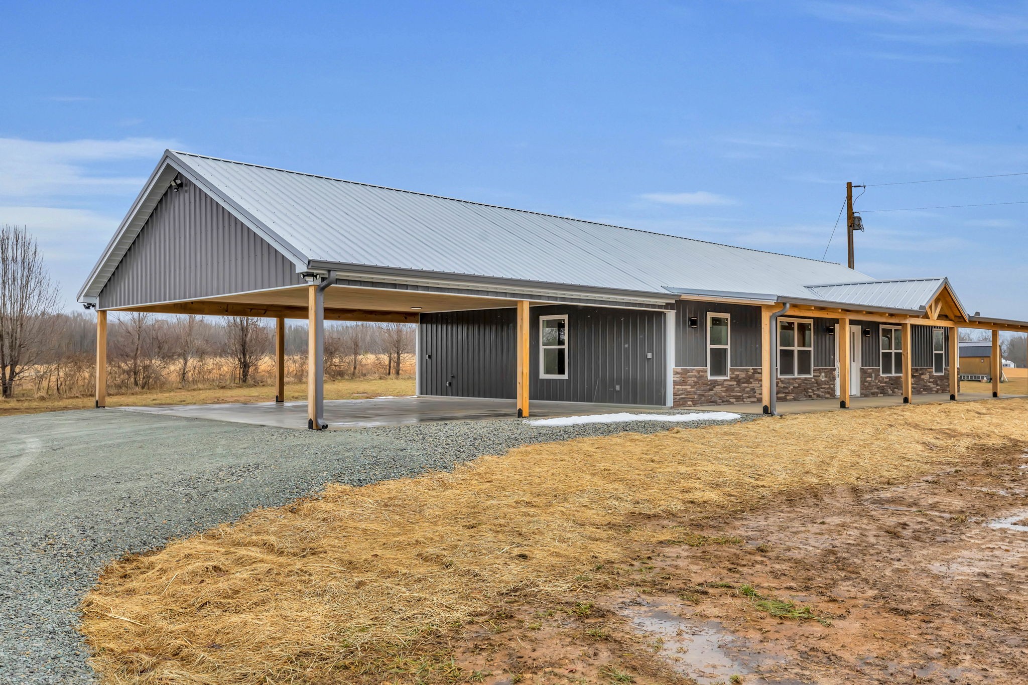 129 Colonial Road Hohenwald, TN 38462 - Photo 2 of 33 a front view of a house with a yard and garage
