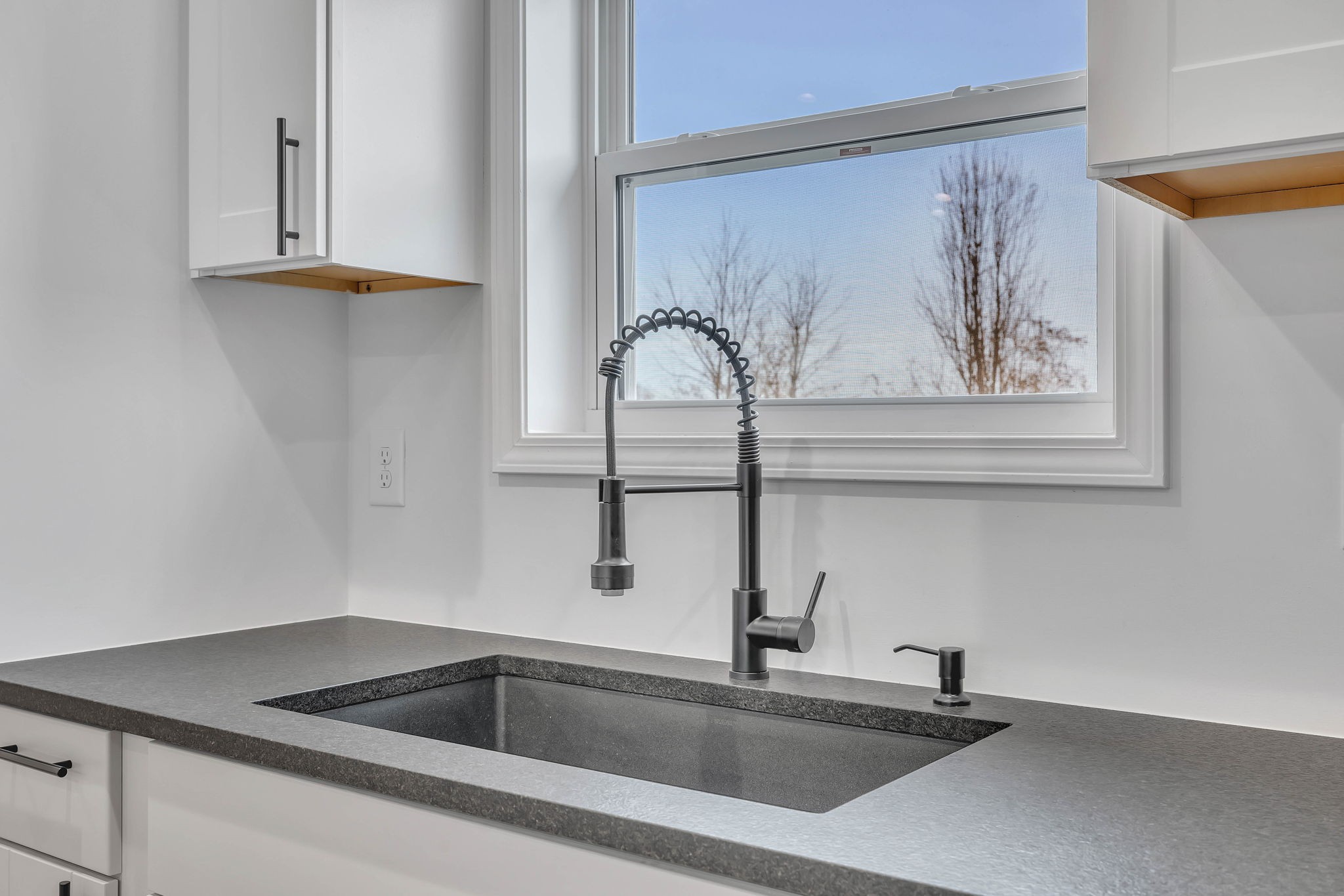 129 Colonial Road Hohenwald, TN 38462 - Photo 21 of 33 a kitchen with a sink and a window