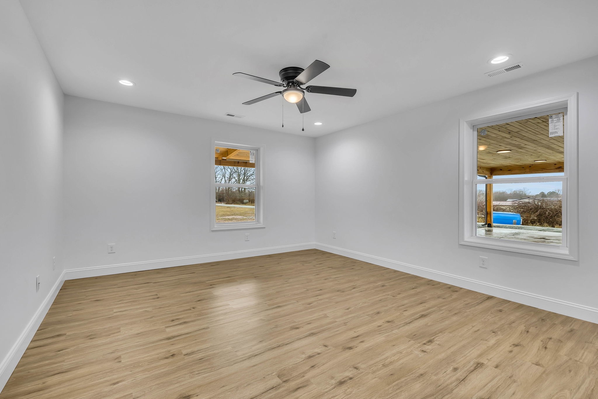 129 Colonial Road Hohenwald, TN 38462 - Photo 23 of 33 wooden floor in an empty room with a window