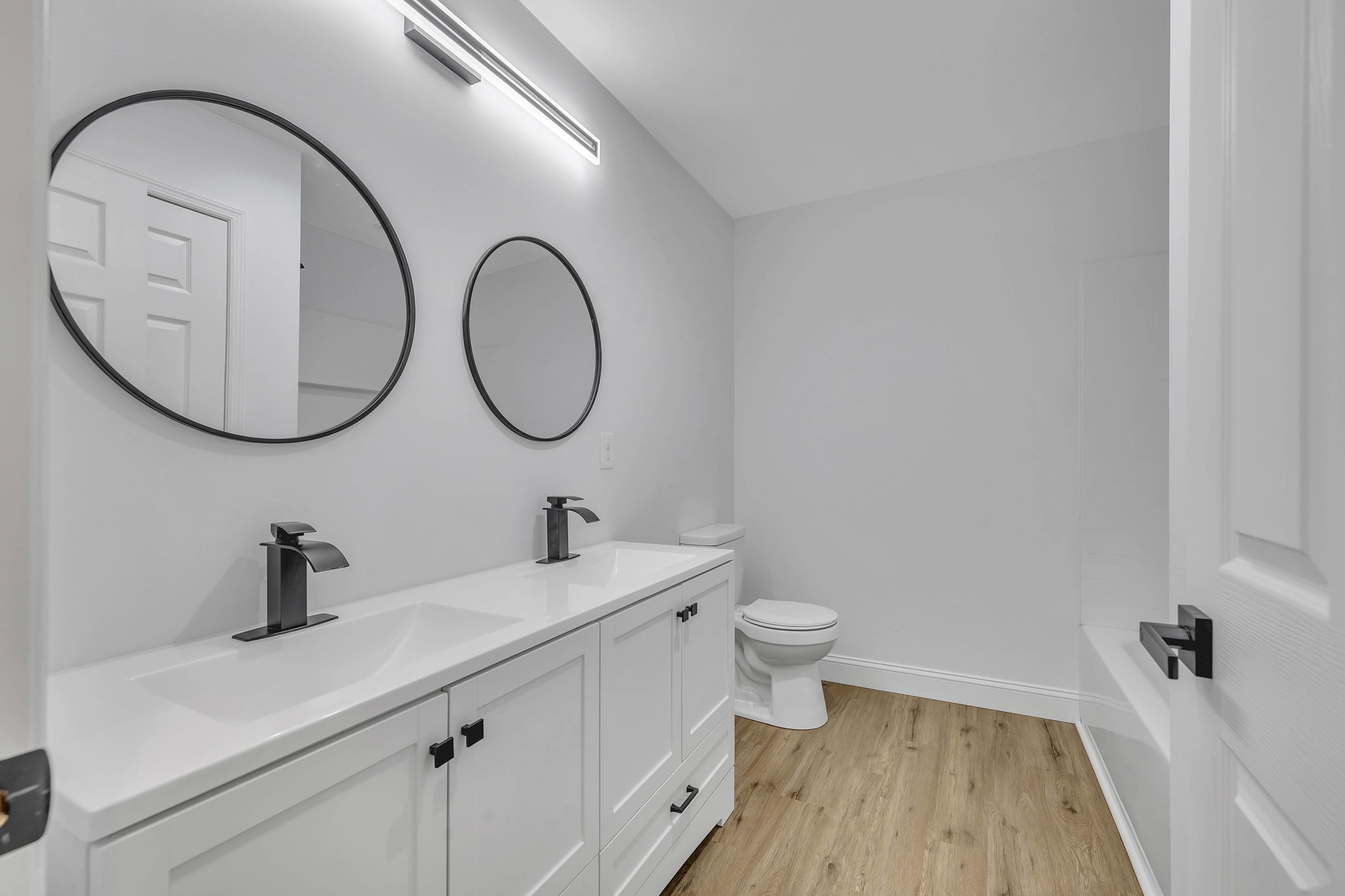 129 Colonial Road Hohenwald, TN 38462 - Photo 31 of 33 a bathroom with a toilet a sink and a mirror