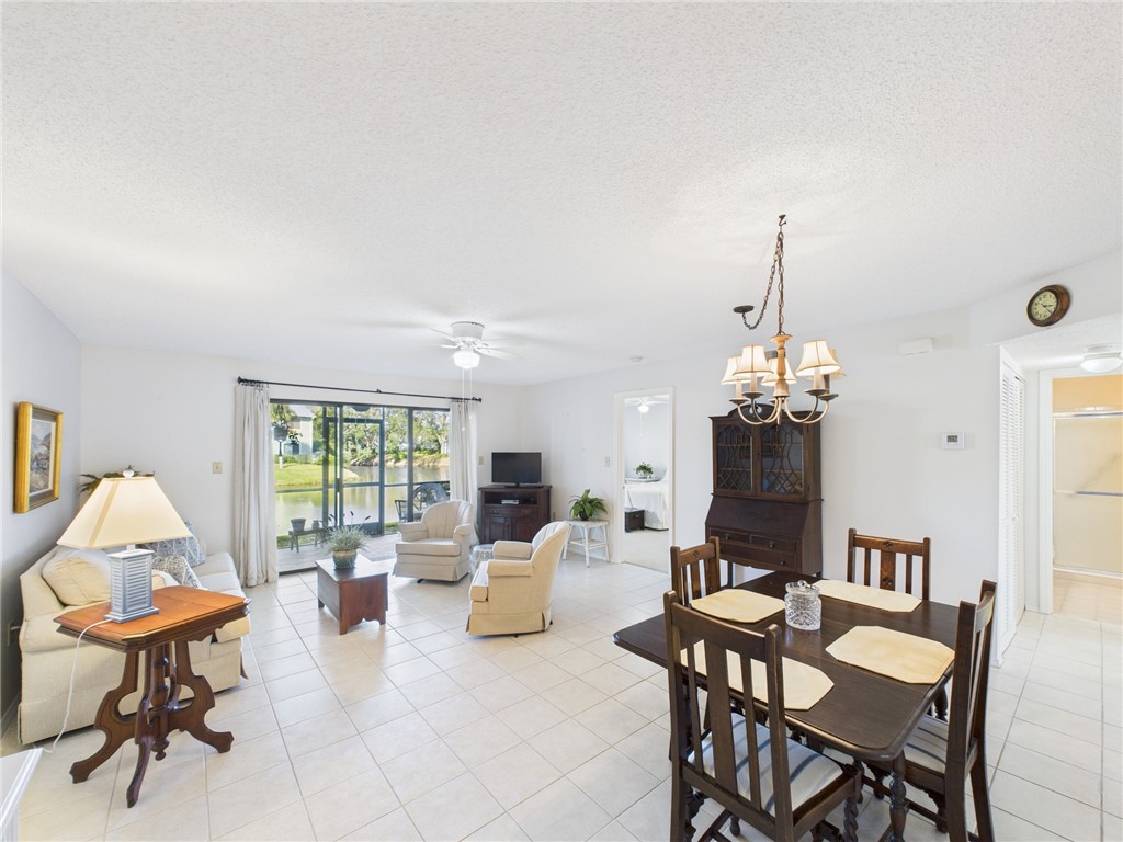 5730 Pelican Pointe Drive, Unit 2 Sebastian, FL 32958 - Photo 15 of 19 a view of a dining room with furniture