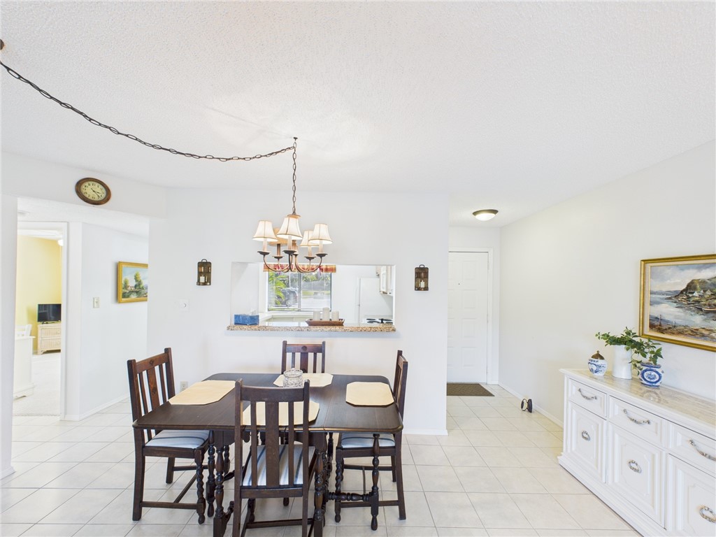 5730 Pelican Pointe Drive, Unit 2 Sebastian, FL 32958 - Photo 16 of 19 a view of a dining room with furniture