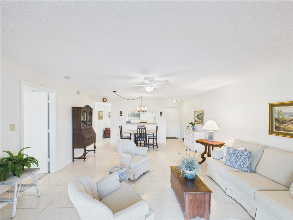 5730 Pelican Pointe Drive, Unit 2 Sebastian, FL 32958 - Photo 17 of 19 a living room with furniture and white walls
