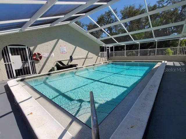 a view of a living room with furniture and a window