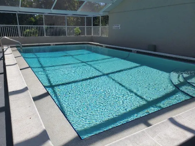 a kitchen with a refrigerator a sink and cabinets