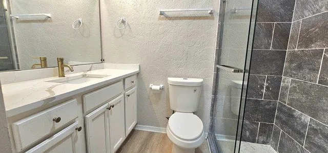 a view of room with wooden floor