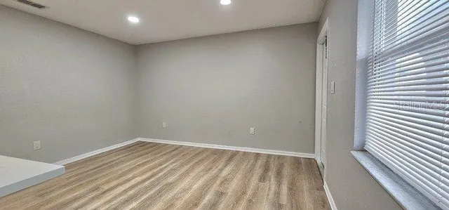a kitchen with stainless steel appliances a refrigerator sink and microwave