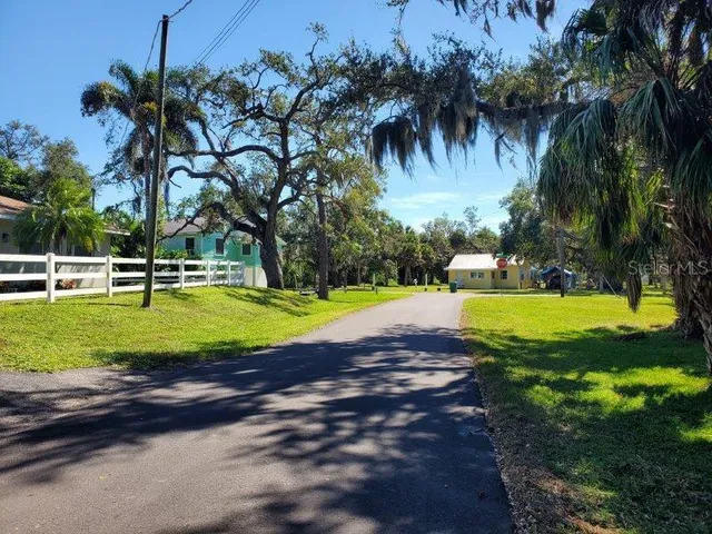 a view of a balcony with two chairs and a table