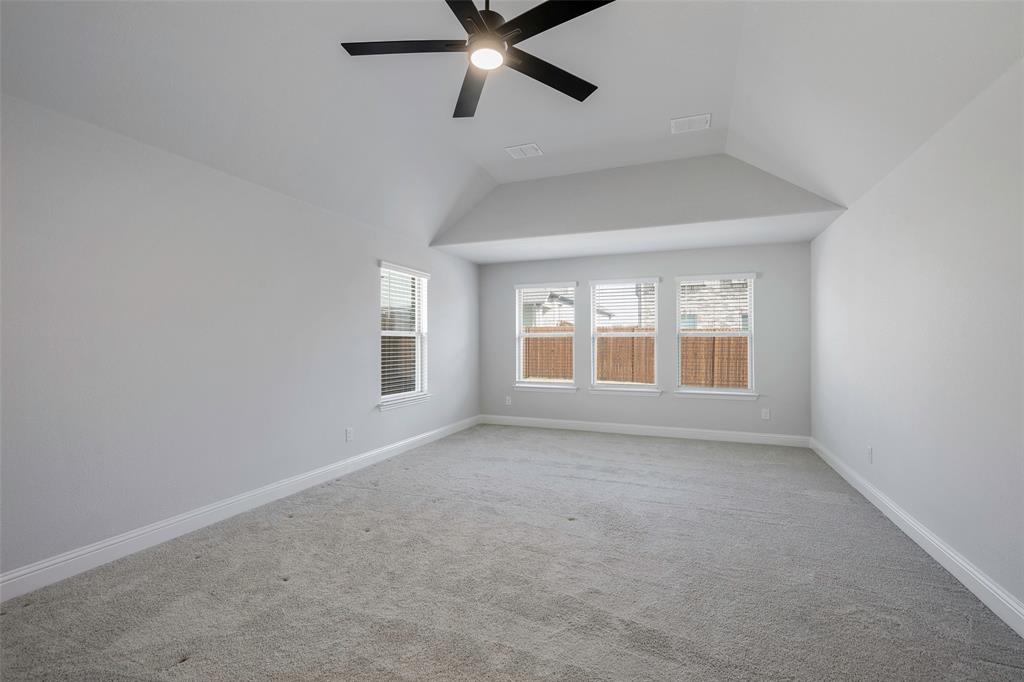 226 Comanche Trail Alvarado, TX 76009 - Photo 14 of 28 an empty room with a window and a ceiling fan