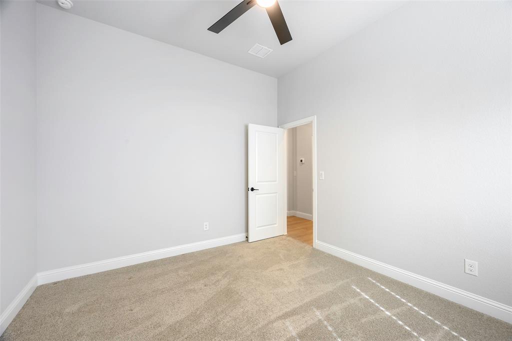 226 Comanche Trail Alvarado, TX 76009 - Photo 23 of 28 an empty room with ceiling fan and window