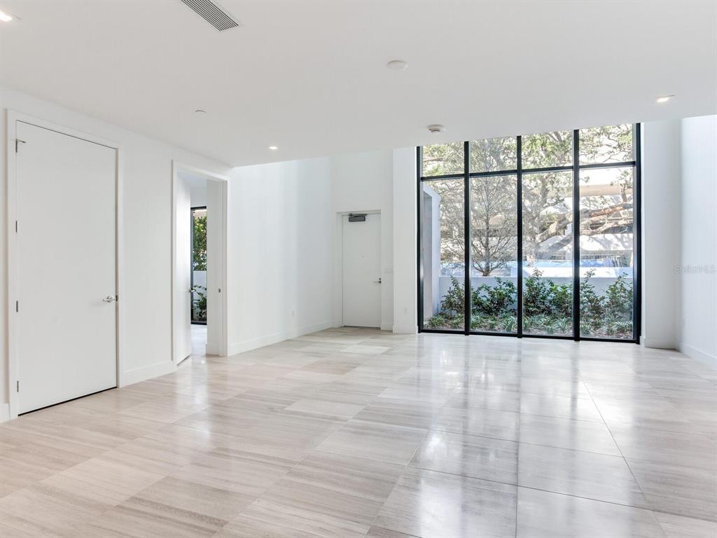 3020 West Santiago Street, Unit 4 Tampa, FL 33629 - Photo 42 of 99 a view of an empty room with glass door