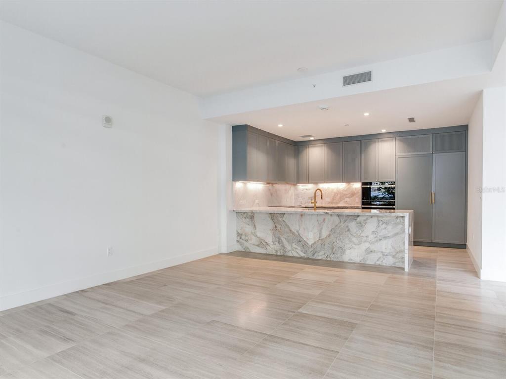 3020 West Santiago Street, Unit 4 Tampa, FL 33629 - Photo 54 of 99 a view of kitchen with kitchen island a sink and a refrigerator