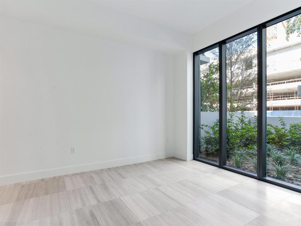 3020 West Santiago Street, Unit 4 Tampa, FL 33629 - Photo 56 of 99 a view of a room with wooden floor and a window