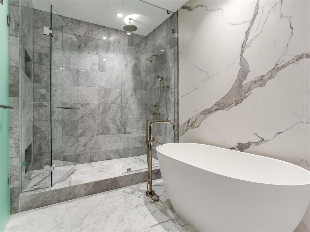 3020 West Santiago Street, Unit 4 Tampa, FL 33629 - Photo 79 of 99 a bathroom with a bathtub and a shower