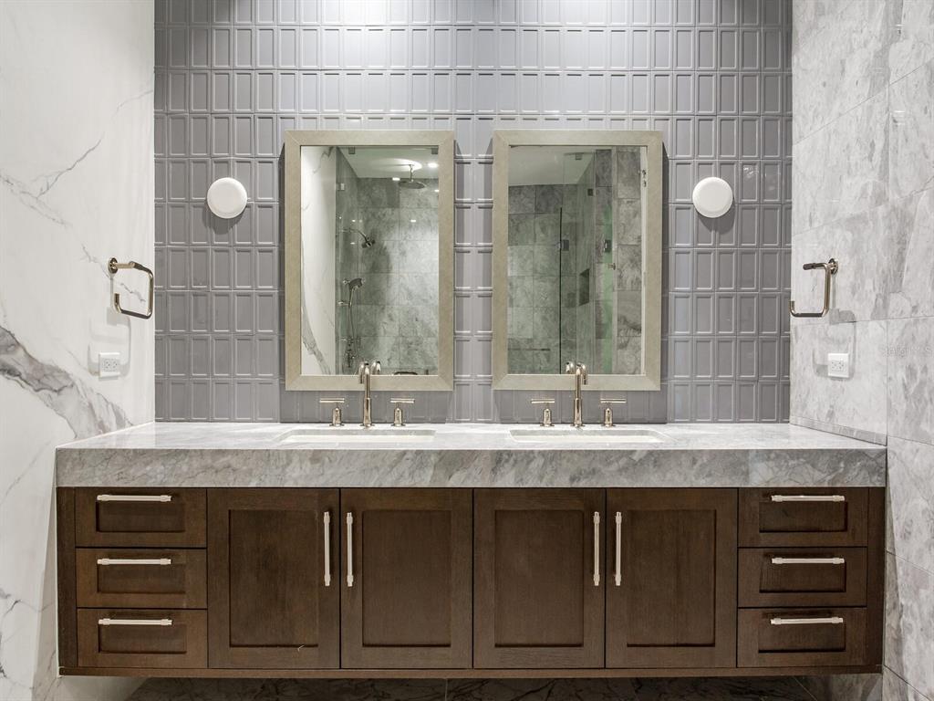 3020 West Santiago Street, Unit 4 Tampa, FL 33629 - Photo 81 of 99 a bathroom with a granite countertop sink and a mirror