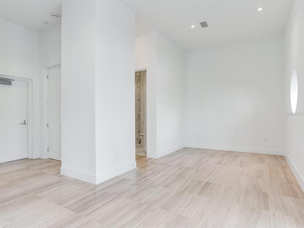 3020 West Santiago Street, Unit 4 Tampa, FL 33629 - Photo 87 of 99 an empty room with wooden floor