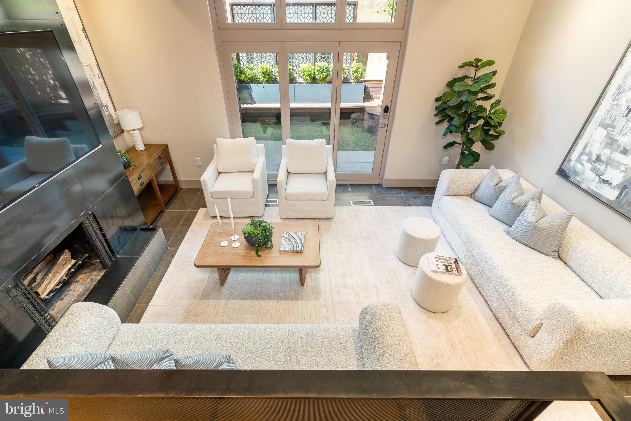 406 South 6th Street Philadelphia, PA 19147 - Photo 13 of 56 a living room with furniture and a potted plant
