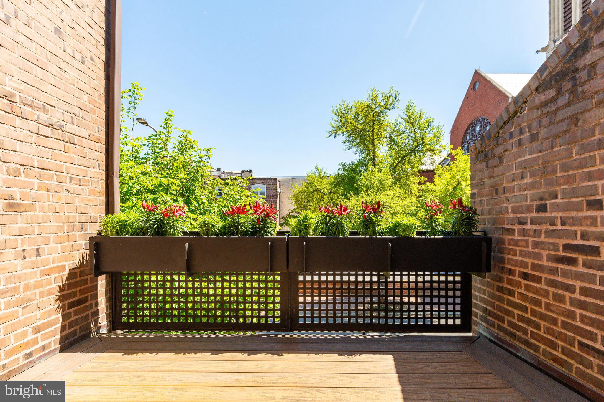 406 South 6th Street Philadelphia, PA 19147 - Photo 34 of 56 a view of a wooden fence and bench
