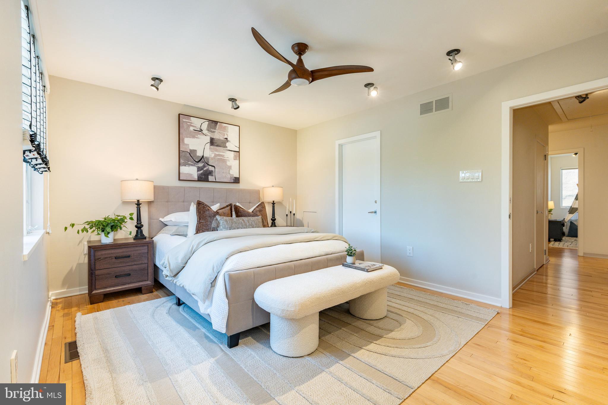 406 South 6th Street Philadelphia, PA 19147 - Photo 37 of 56 a spacious bedroom with a bed and wooden floor