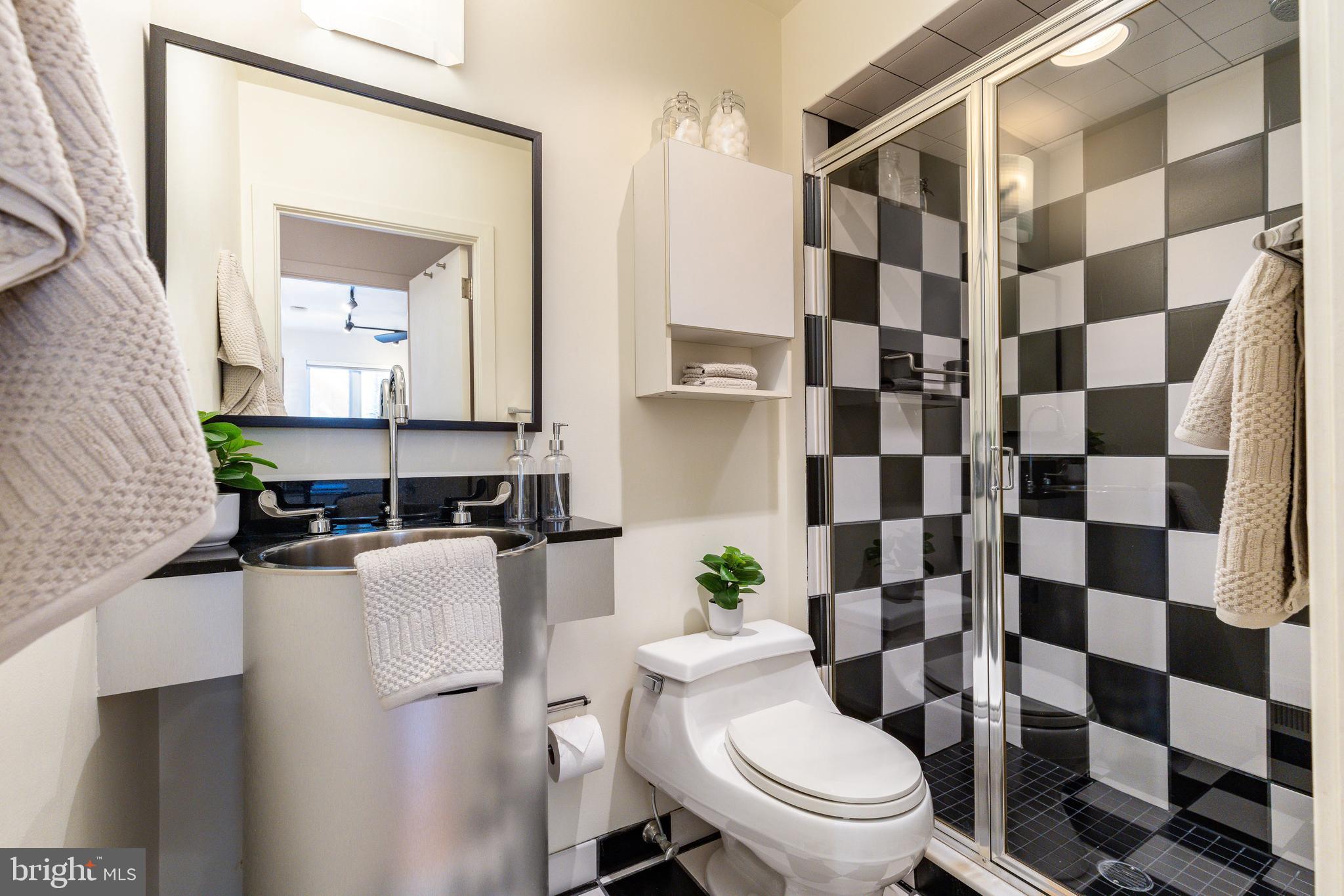 406 South 6th Street Philadelphia, PA 19147 - Photo 45 of 56 a white toilet sitting next to a bathroom sink