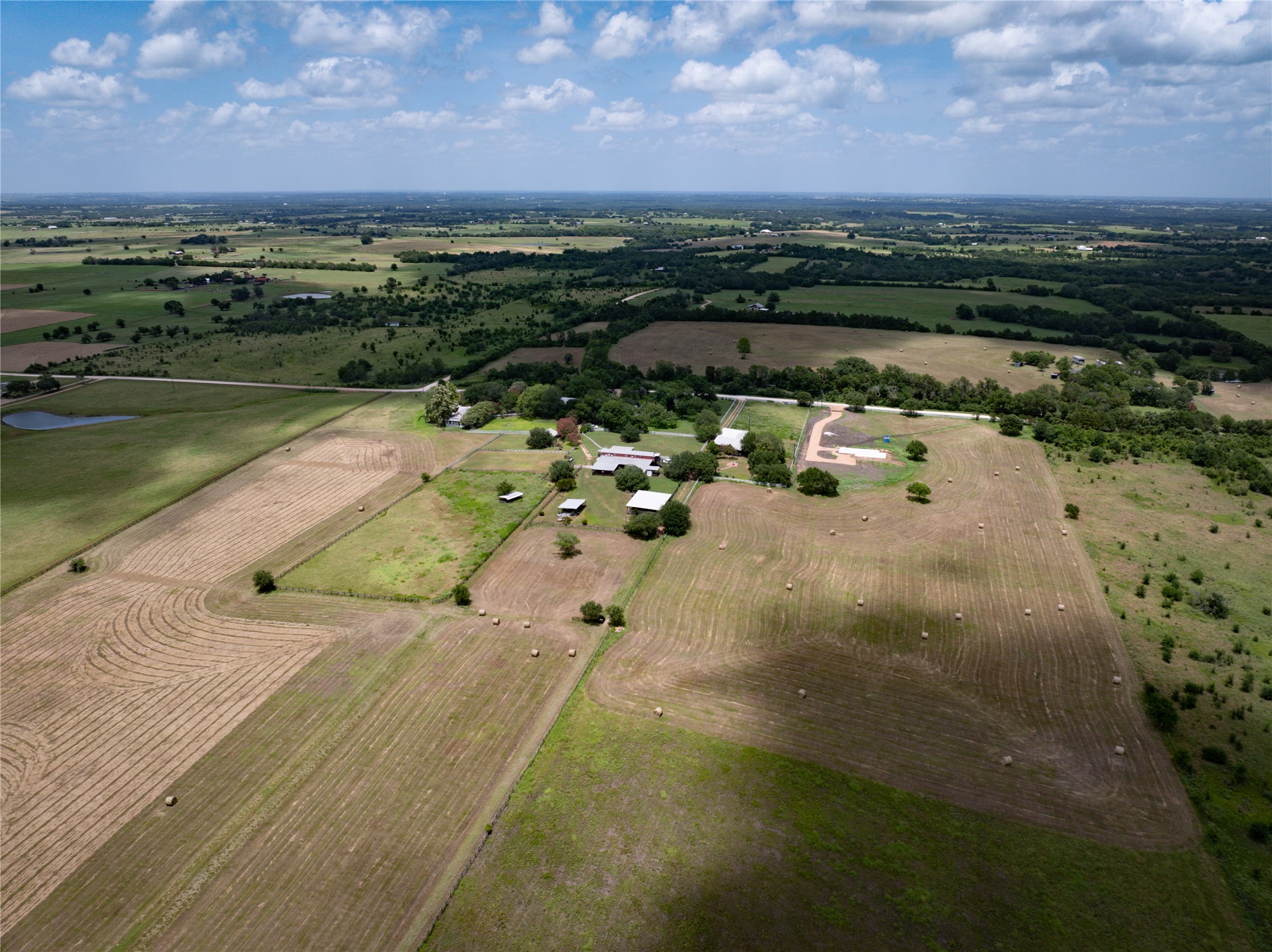 1281 Post Oak Point Road New Ulm, TX 78950 - Photo 28 of 29 Vast, verdant fields offer abundant space for agriculture and serene rural living.