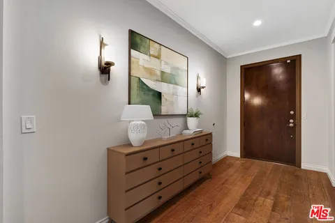 a bedroom with a bed and a mirror