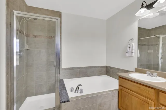 a bathroom with a tub and sink