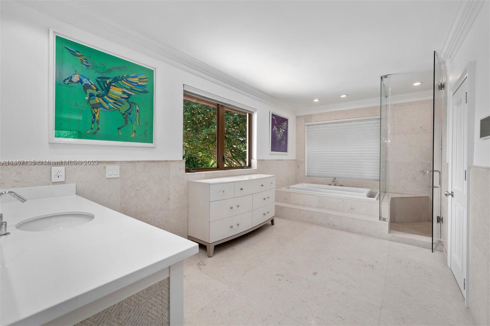 2201 Sunset Drive Miami Beach, FL 33140 - Photo 16 of 35 a bathroom with a tub a sink and a window