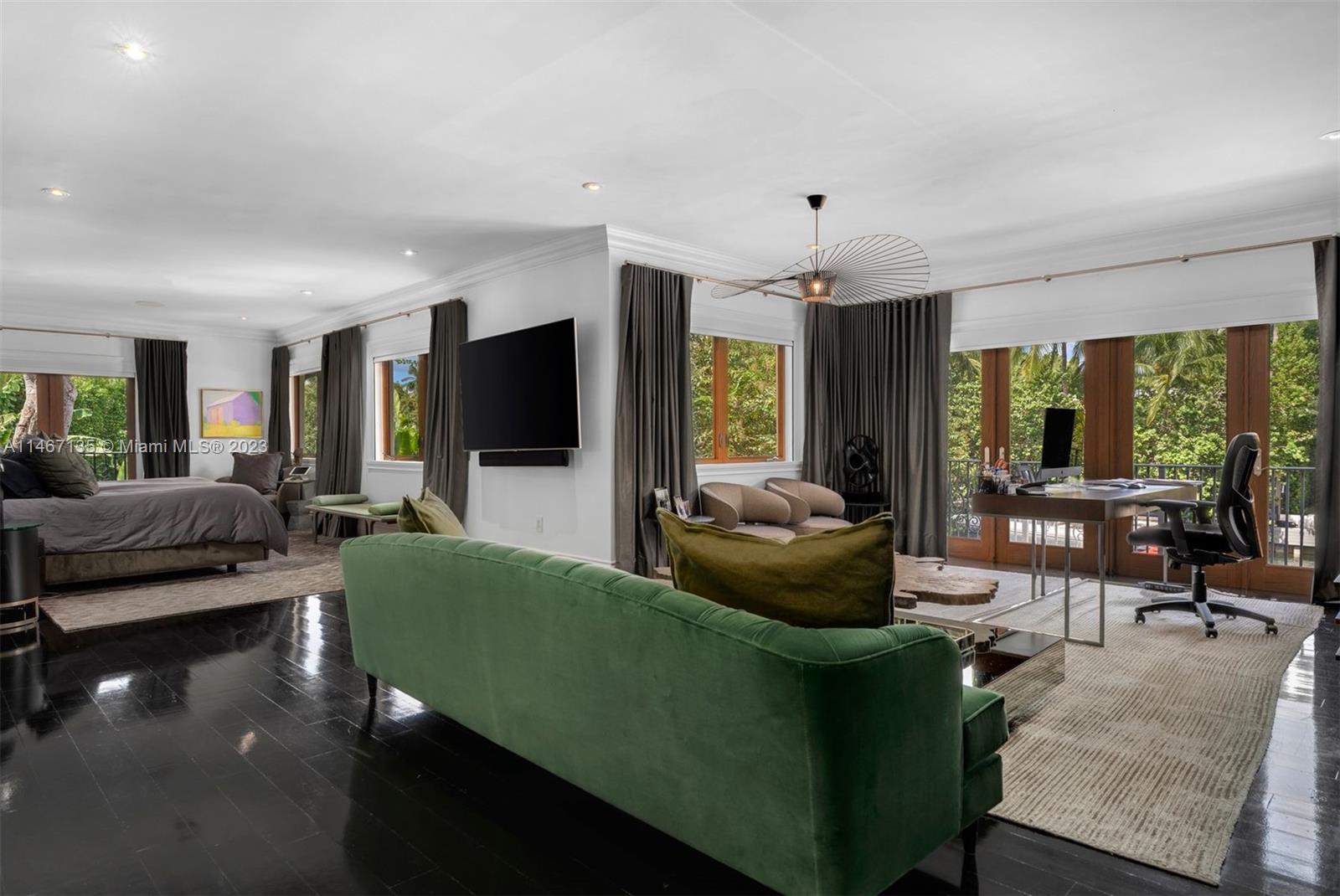 2201 Sunset Drive Miami Beach, FL 33140 - Photo 17 of 35 a living room with furniture and a flat screen tv