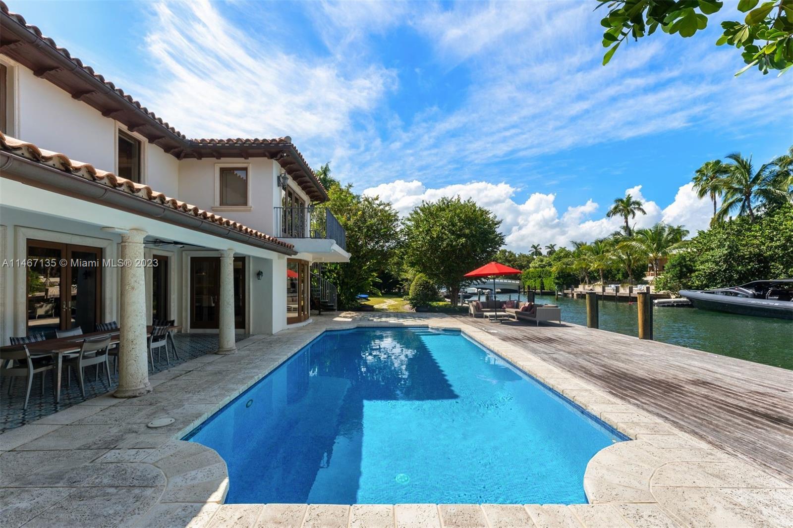 2201 Sunset Drive Miami Beach, FL 33140 - Photo 4 of 35 a swimming pool with outdoor seating