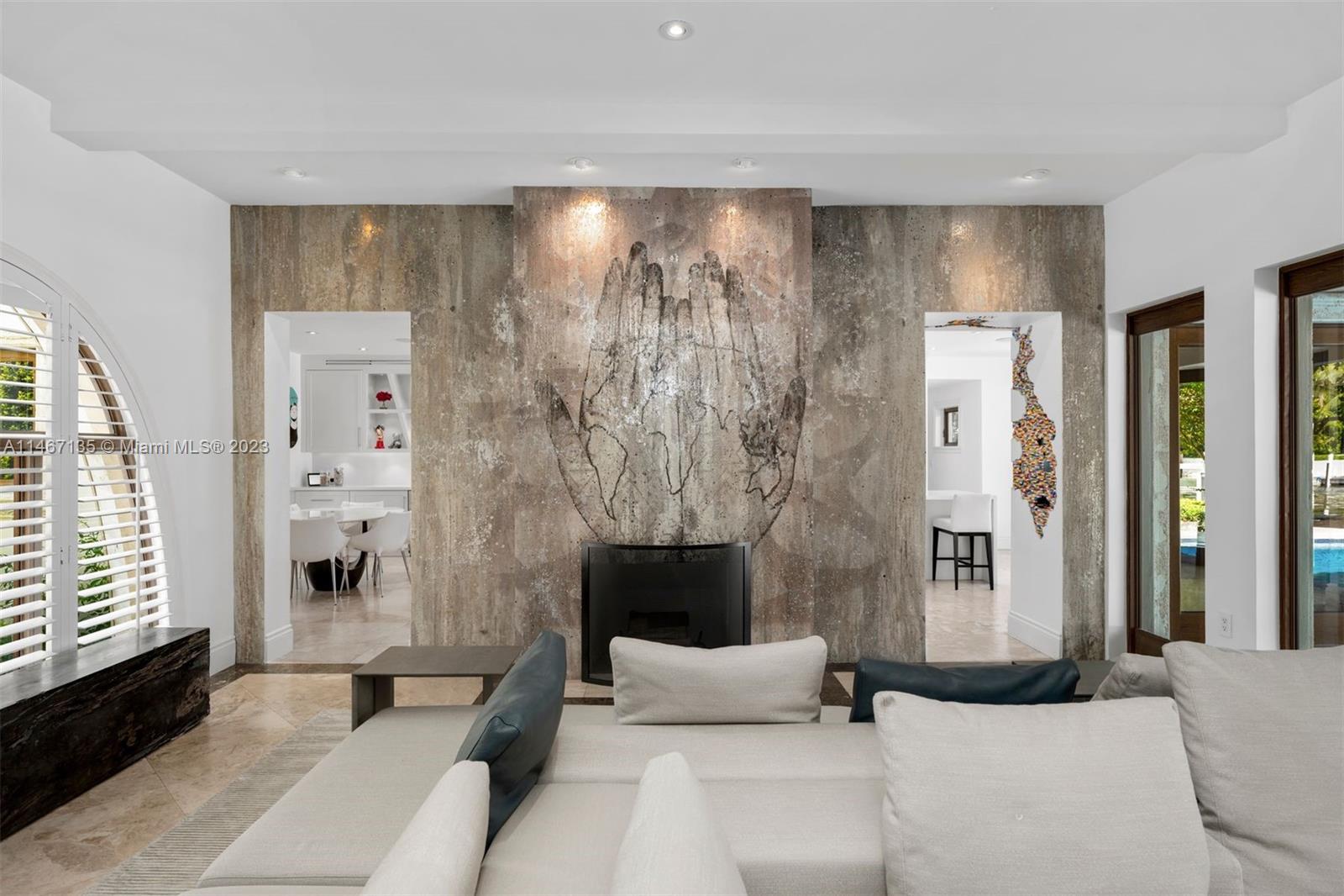 2201 Sunset Drive Miami Beach, FL 33140 - Photo 7 of 35 a living room with furniture and a fireplace