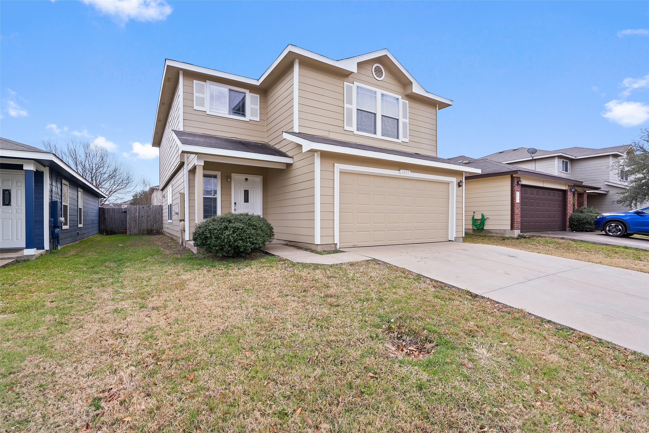 1617 Anise Drive Austin, TX 78741 - Photo 1 of 35 Traditional-style home with an attached garage and driveway