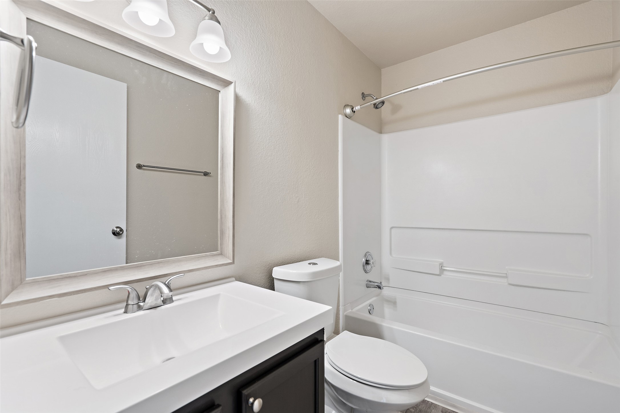 1617 Anise Drive Austin, TX 78741 - Photo 13 of 35 Full bath featuring vanity and shower combination