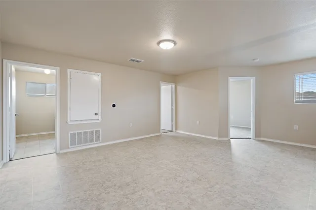 an empty room with closet area