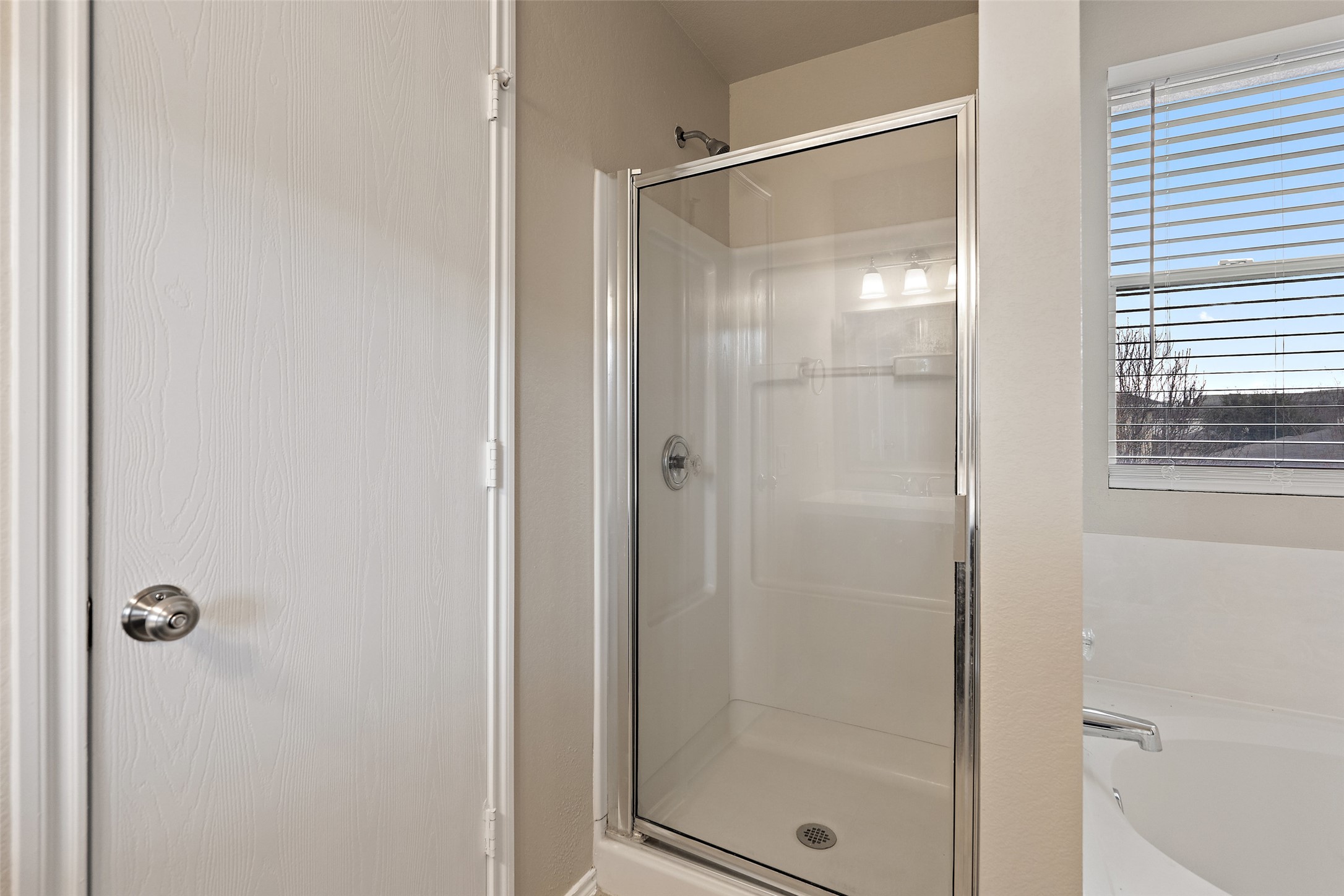 1617 Anise Drive Austin, TX 78741 - Photo 21 of 35 Full bath featuring a shower stall and a garden tub