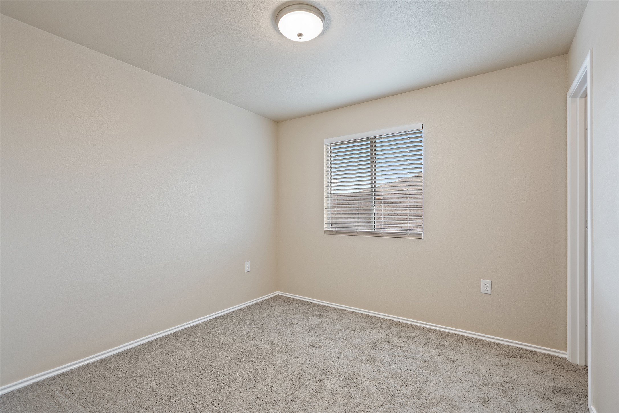 1617 Anise Drive Austin, TX 78741 - Photo 25 of 35 Carpeted spare room featuring baseboards