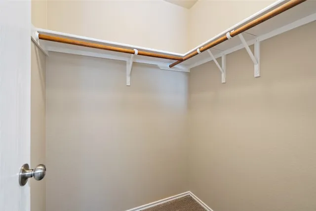 a view of a room with racks on the wall