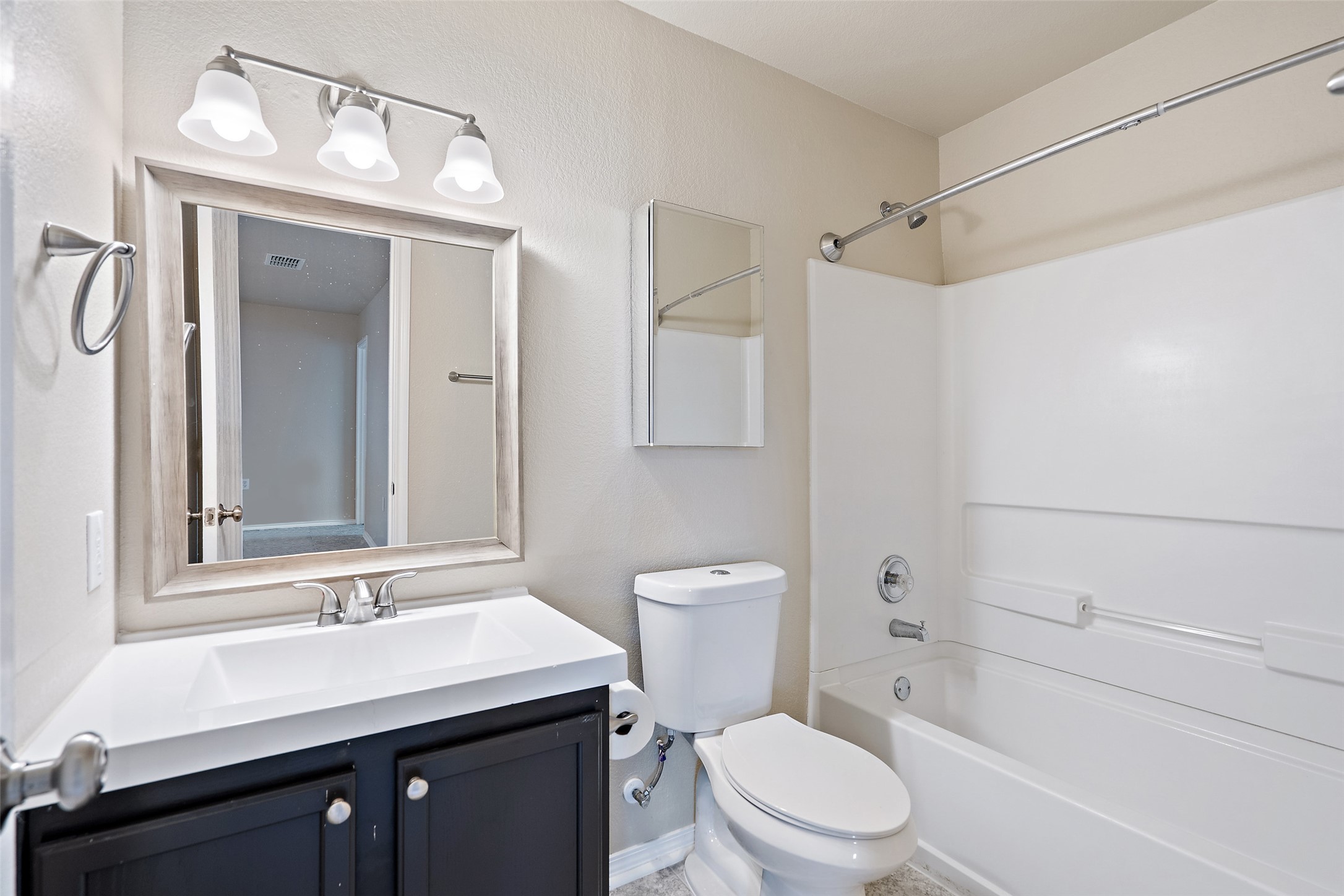 1617 Anise Drive Austin, TX 78741 - Photo 32 of 35 Bathroom featuring shower combination and vanity