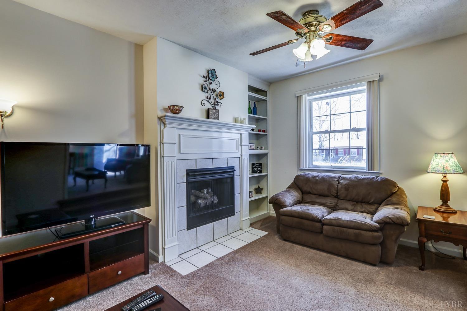 721 Doss Road Concord, VA 24538 - Photo 13 of 35 a living room with furniture and a fireplace