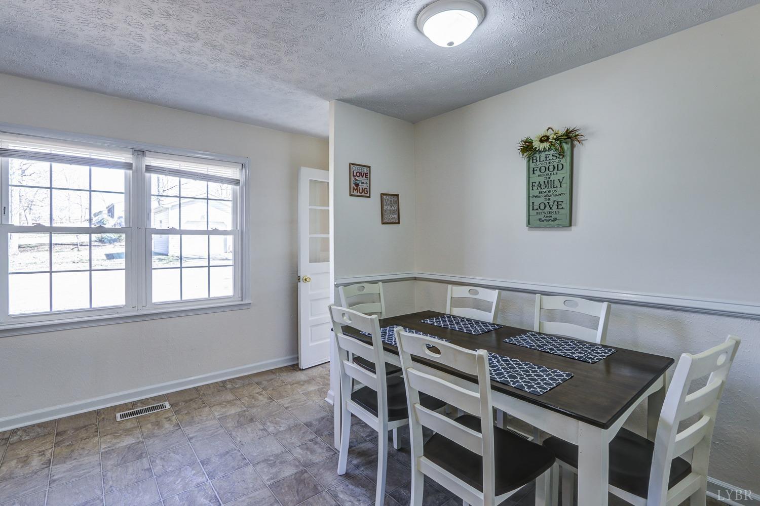 721 Doss Road Concord, VA 24538 - Photo 14 of 35 a view of a dining room with furniture and a window