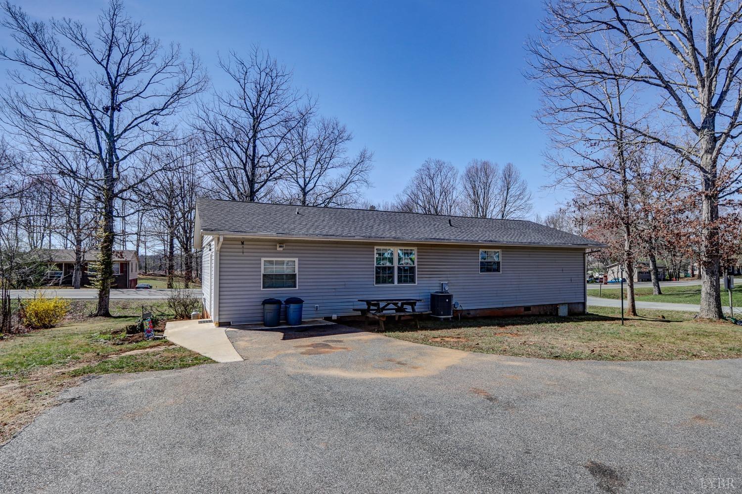 721 Doss Road Concord, VA 24538 - Photo 2 of 35 a view of a house with a yard and garage