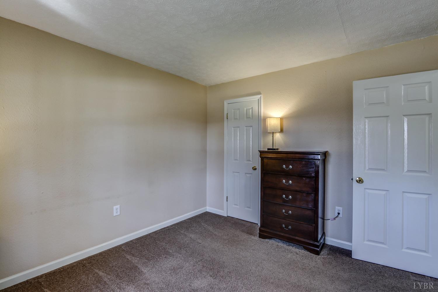 721 Doss Road Concord, VA 24538 - Photo 28 of 35 a view of an empty room with cabinet and a window