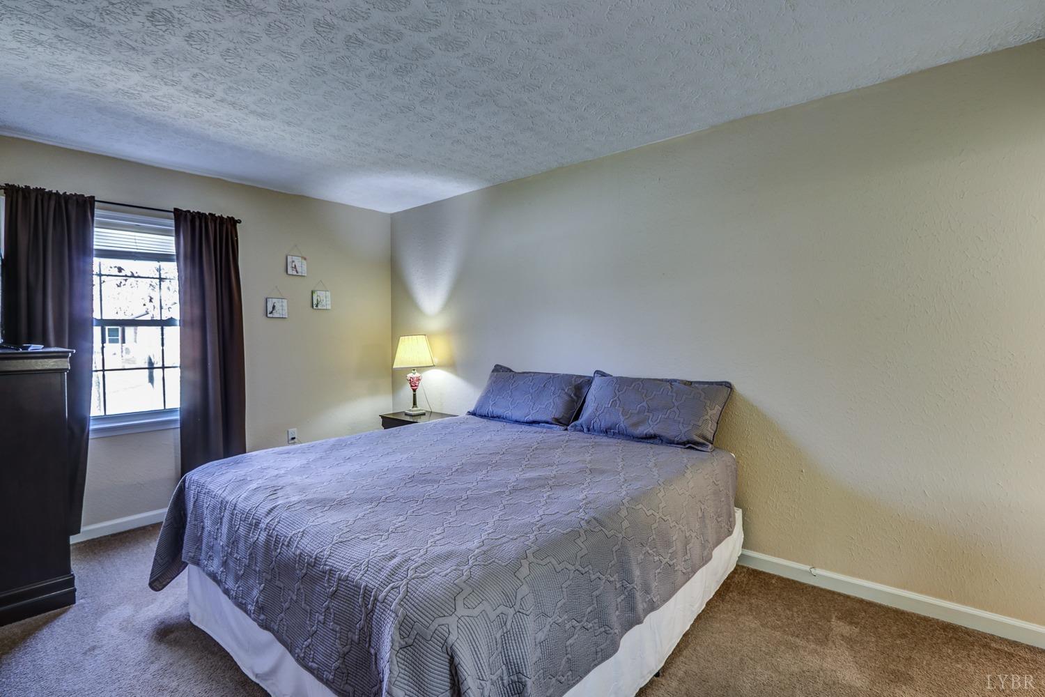 721 Doss Road Concord, VA 24538 - Photo 29 of 35 a bedroom with a bed and window