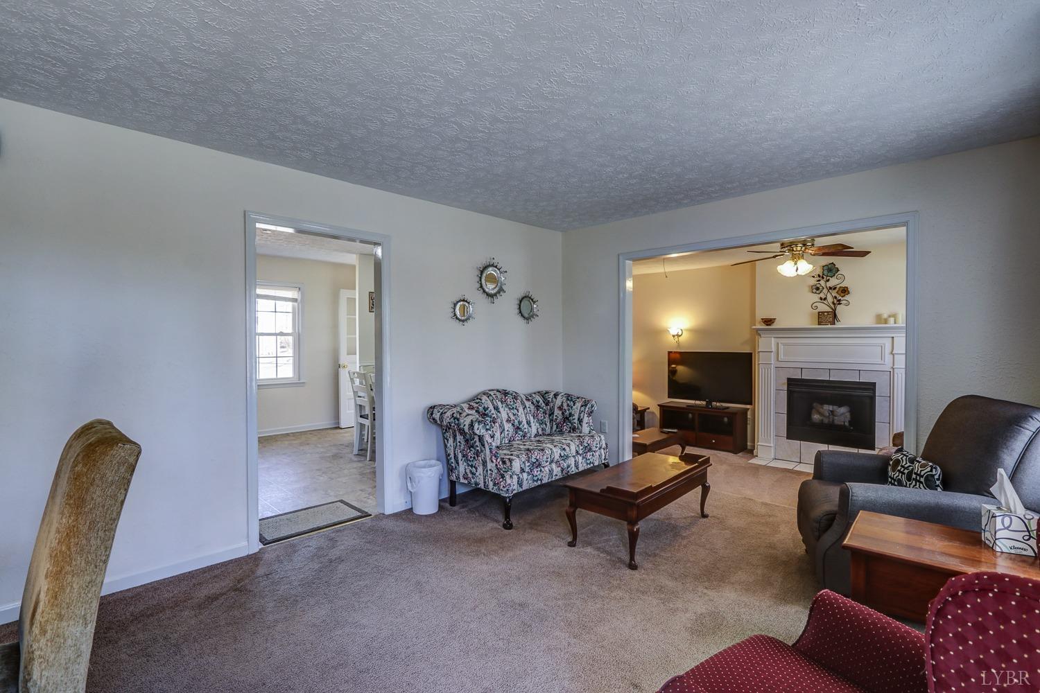 721 Doss Road Concord, VA 24538 - Photo 3 of 35 a living room with furniture and a fireplace