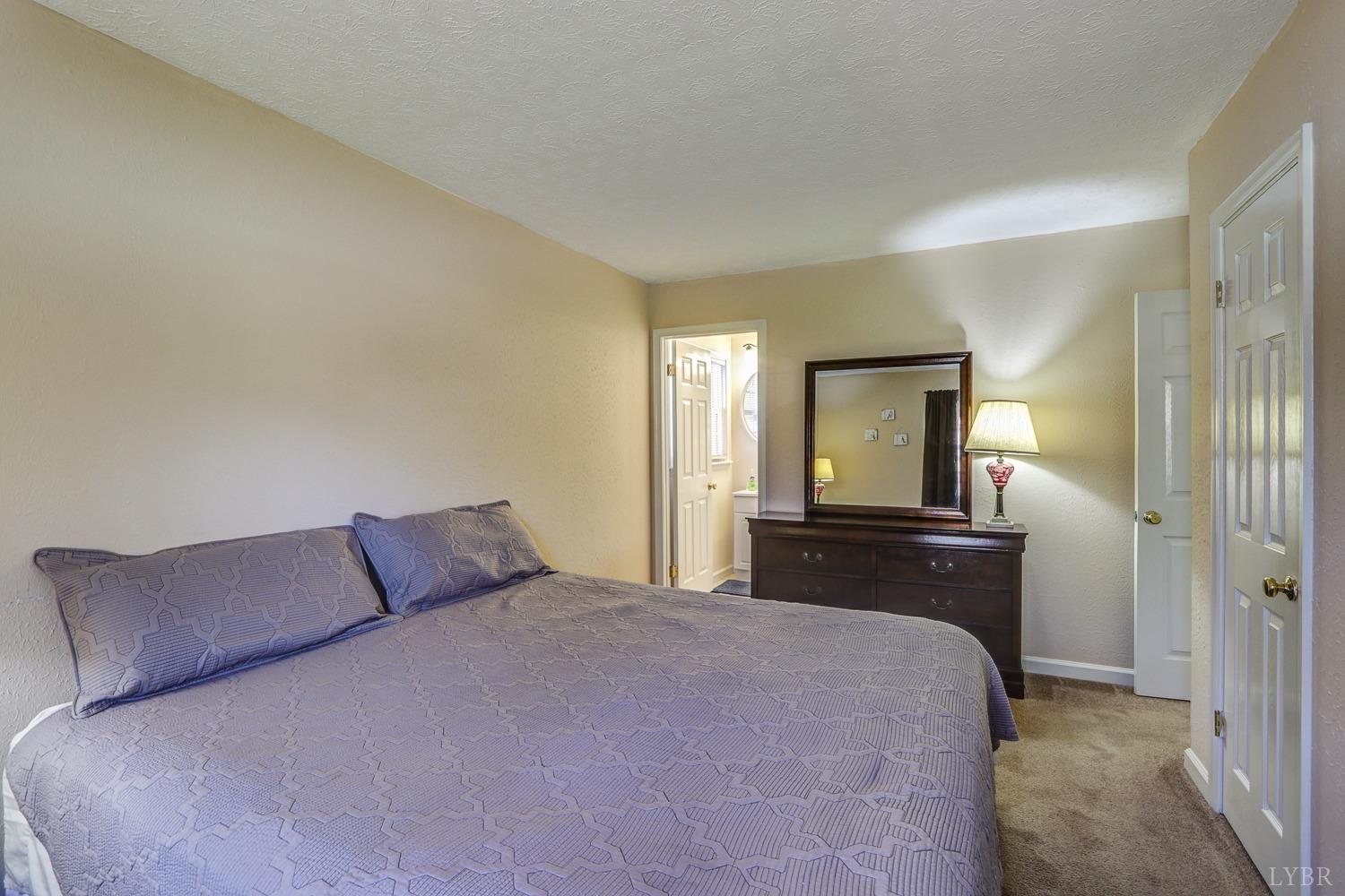 721 Doss Road Concord, VA 24538 - Photo 31 of 35 a bedroom with a bed and a dresser in it