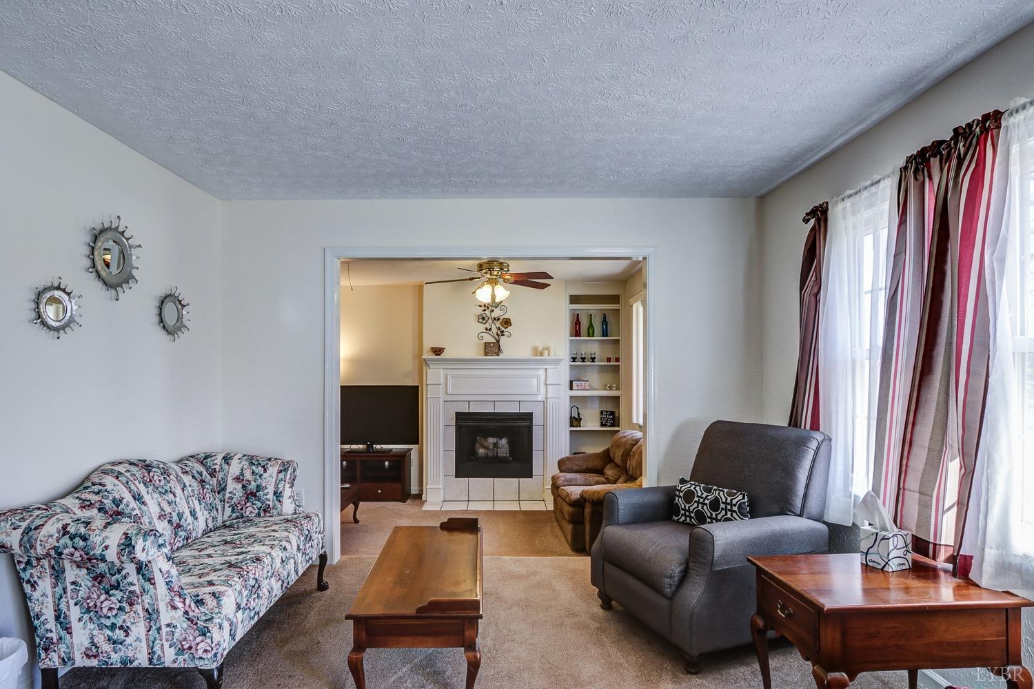 721 Doss Road Concord, VA 24538 - Photo 5 of 35 a living room with furniture and a fireplace