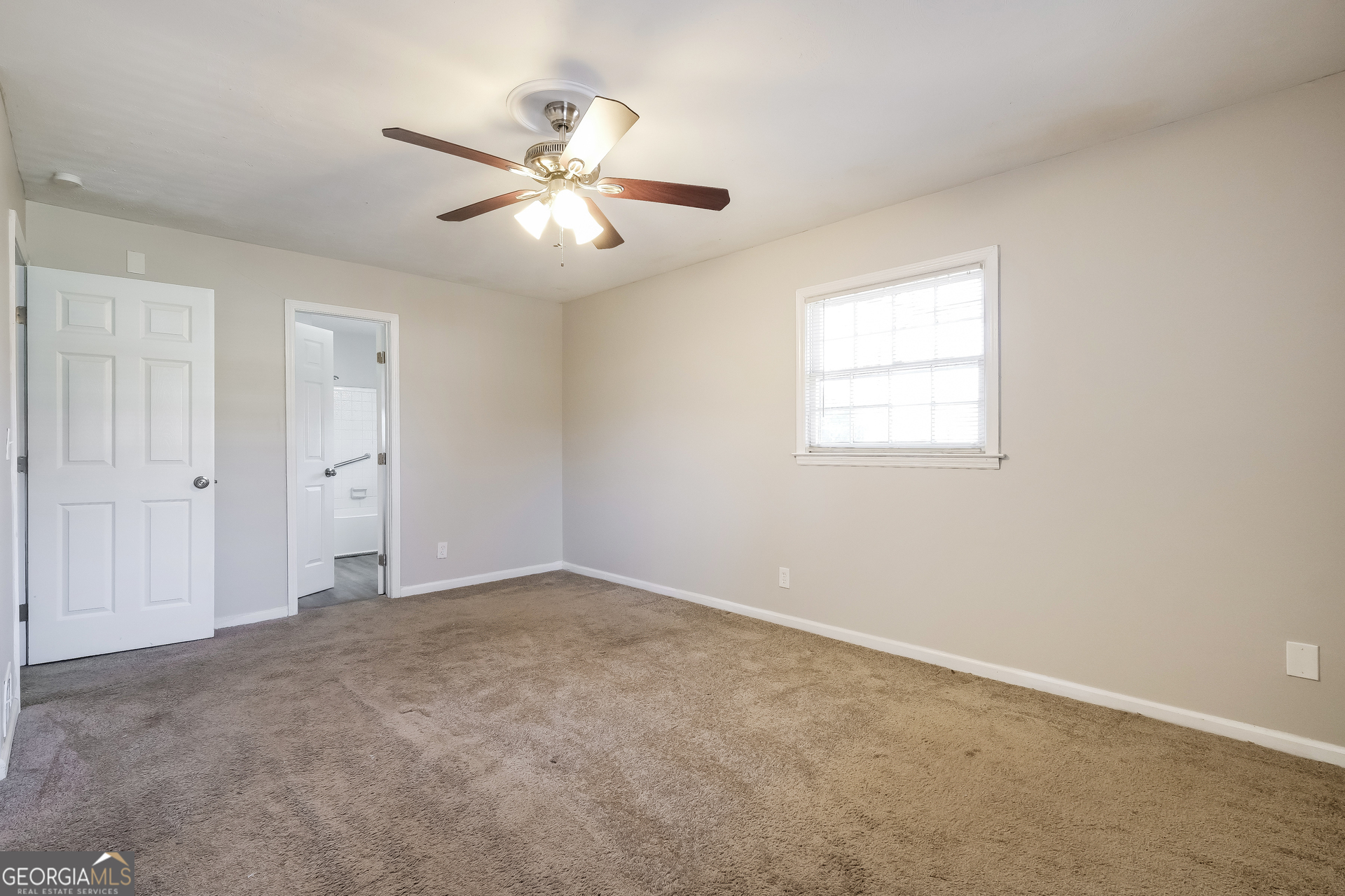 3660 Sterling Ridge Way Decatur, GA 30032 - Photo 12 of 23 an empty room with windows and fan