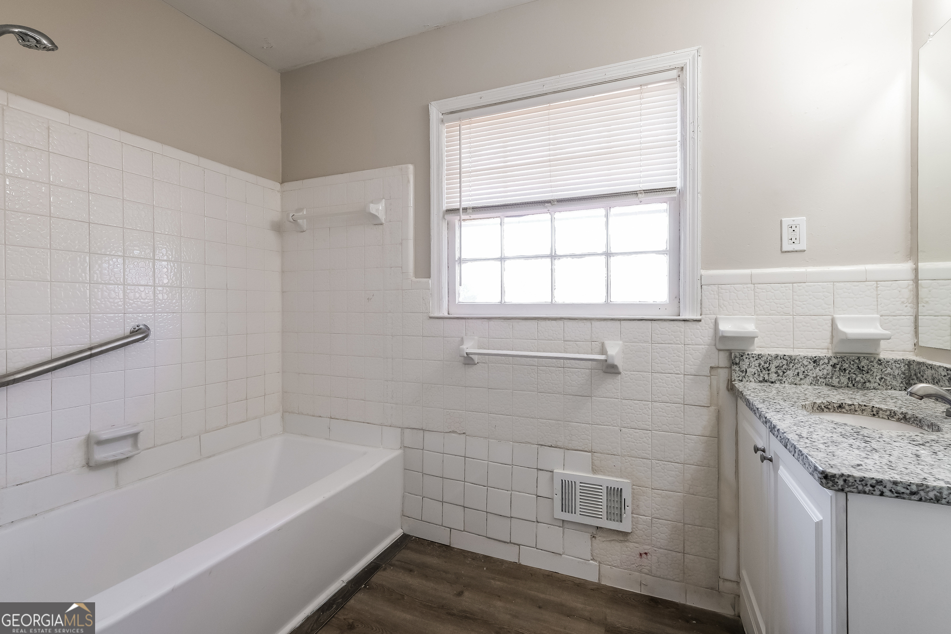 3660 Sterling Ridge Way Decatur, GA 30032 - Photo 14 of 23 a bathroom with a granite countertop sink a bathtub and window