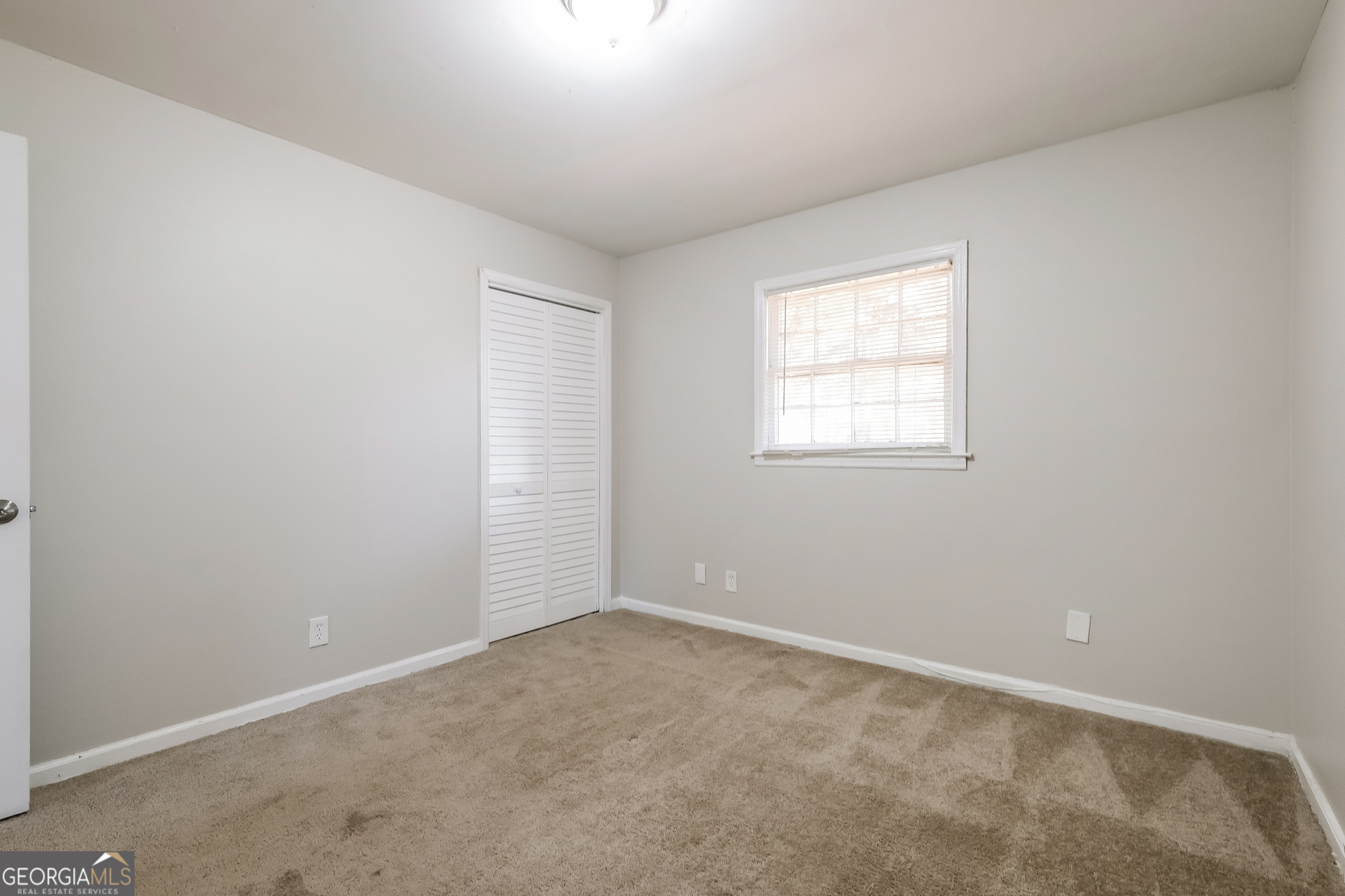 3660 Sterling Ridge Way Decatur, GA 30032 - Photo 16 of 23 an empty room with a window
