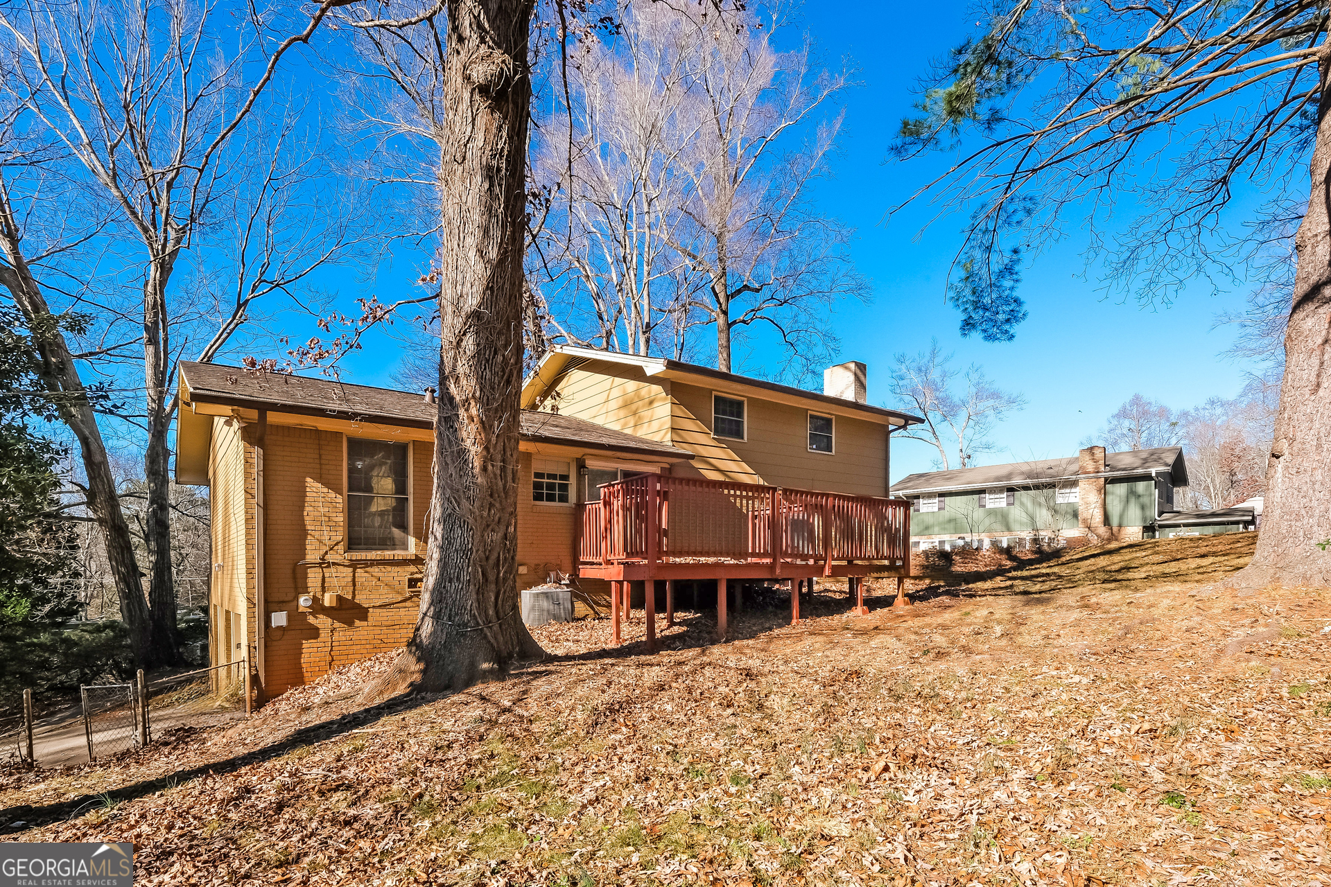 3660 Sterling Ridge Way Decatur, GA 30032 - Photo 20 of 23 a view of a house with a yard covered in snow